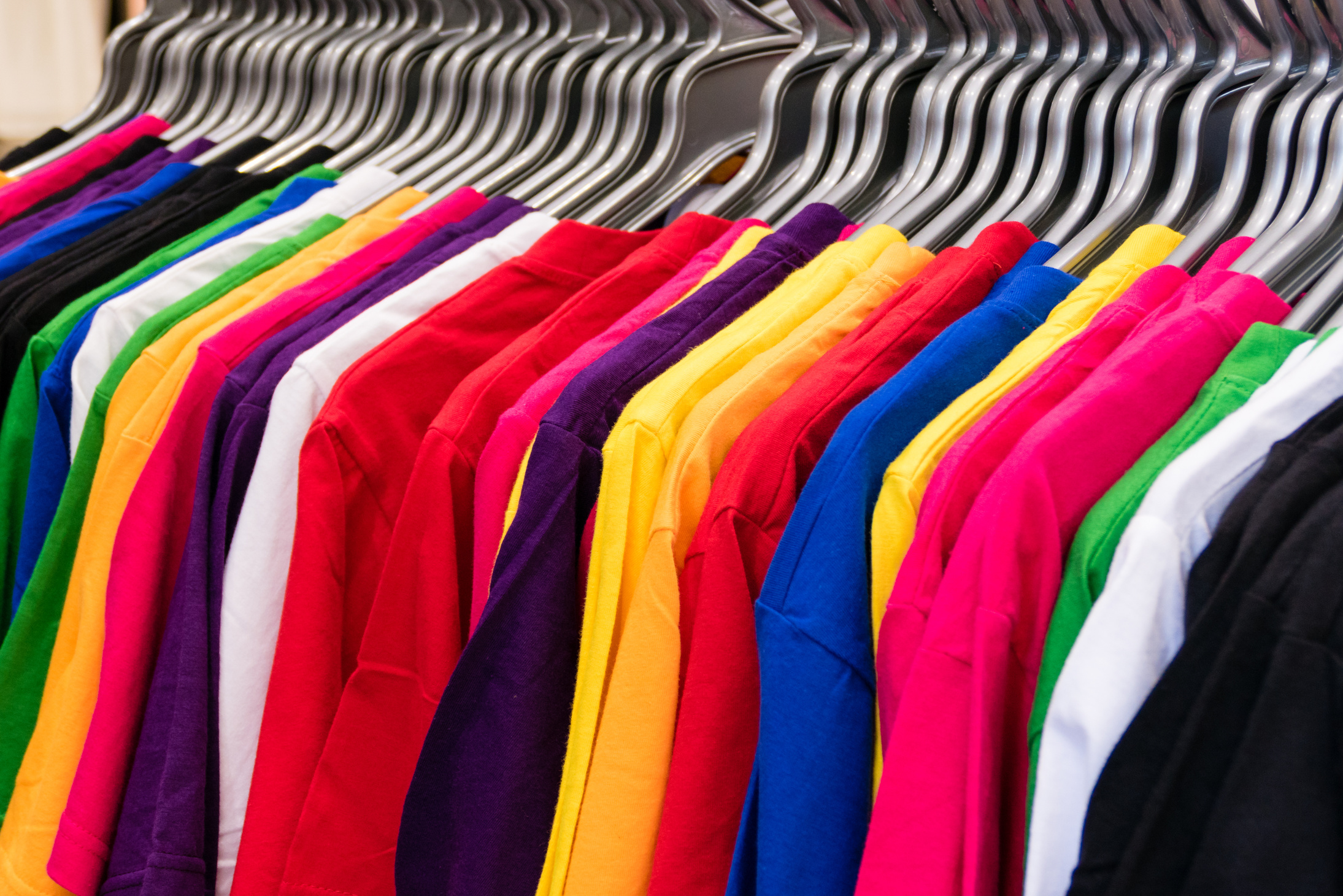 Various Colored T-Shirts on Hangers